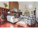 Bright living room boasts a brick fireplace, vaulted ceilings, and abundant natural light with hardwood floors at 8362 N County Road 650 E, Brownsburg, IN 46112