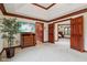 Bright main bedroom featuring a large bed, a TV and access to other rooms, and stylish furnishings at 8362 N County Road 650 E, Brownsburg, IN 46112