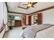 Spacious main bedroom with tray ceiling, wood trim, large windows, view to other rooms, and stylish furnishings at 8362 N County Road 650 E, Brownsburg, IN 46112