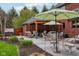 Spacious outdoor living area with comfortable seating, a dining area, and a pergola for shade and relaxation at 8362 N County Road 650 E, Brownsburg, IN 46112