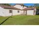 Spacious backyard with green grass, wooden fence, and exterior access to home at 9056 E 650 N, Wilkinson, IN 46186