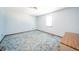 Standard bedroom with a small window, light blue walls and trim, and worn, patterned carpet at 9056 E 650 N, Wilkinson, IN 46186
