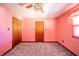 This bedroom has carpeting, a ceiling fan and two closets at 9056 E 650 N, Wilkinson, IN 46186