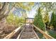 A wooden walkway leads to a gazebo through an attractively landscaped yard at 9056 E 650 N, Wilkinson, IN 46186
