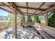 Spacious gazebo featuring wooden benches and a view of the landscaped backyard at 9056 E 650 N, Wilkinson, IN 46186