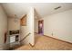 Upstairs hallway features carpet floors, wood trim, and access to multiple rooms at 9056 E 650 N, Wilkinson, IN 46186
