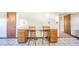 Bright kitchen features a breakfast bar with seating, complemented by decorative wall art at 9056 E 650 N, Wilkinson, IN 46186