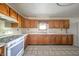 Well-equipped kitchen featuring a range, abundant cabinetry, and countertop space for meal preparation at 9056 E 650 N, Wilkinson, IN 46186