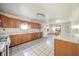 Spacious kitchen features ample cabinetry, a modern refrigerator, and a dining area, perfect for Gathering meals at 9056 E 650 N, Wilkinson, IN 46186