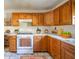 Functional kitchen featuring wooden cabinets, modern appliances, and ample counter space at 9056 E 650 N, Wilkinson, IN 46186