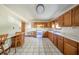 Charming kitchen with wooden cabinets, and a breakfast bar creating a warm and inviting space at 9056 E 650 N, Wilkinson, IN 46186