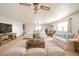 Bright living room featuring two sitting areas and large windows at 9056 E 650 N, Wilkinson, IN 46186