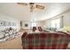 Spacious living room with ceiling fan, carpet and several seating options for Gathering and friends at 9056 E 650 N, Wilkinson, IN 46186