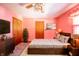 Comfortable main bedroom includes a bed, dresser, and plant for a relaxing retreat at 9056 E 650 N, Wilkinson, IN 46186