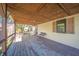 Covered porch with seating area, providing a relaxing outdoor space at 9056 E 650 N, Wilkinson, IN 46186