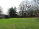 View of a large backyard with a wooden fence and utility shed at 9113 Church Rd, Brownsburg, IN 46112