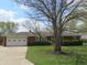 Charming brick ranch home featuring an attached garage and a well-manicured front lawn at 9113 Church Rd, Brownsburg, IN 46112