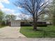 Charming brick ranch home featuring an attached garage and a well-manicured front lawn at 9113 Church Rd, Brownsburg, IN 46112
