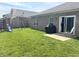 Spacious backyard featuring a patio, grill, swing set, and well-maintained lawn at 914 Baden Manor Dr, Indianapolis, IN 46217