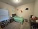 Bright bedroom with soft carpet, neutral walls, with a neatly made twin bed at 914 Baden Manor Dr, Indianapolis, IN 46217