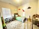 Charming bedroom with dinosaur wall decorations and a comfortable single bed at 914 Baden Manor Dr, Indianapolis, IN 46217