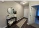 Inviting entryway with sleek dark wood flooring, stylish console table, and contemporary decor at 914 Baden Manor Dr, Indianapolis, IN 46217