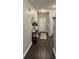 Inviting entryway with sleek dark wood flooring, stylish console table, and contemporary decor at 914 Baden Manor Dr, Indianapolis, IN 46217