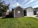 Beautiful single-Gathering home with a brick exterior, lush green lawn, and a two-car garage at 914 Baden Manor Dr, Indianapolis, IN 46217