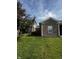 Attractive single-Gathering home with a brick exterior, well-manicured lawn, and mature tree at 914 Baden Manor Dr, Indianapolis, IN 46217