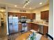 Well-equipped kitchen with stainless steel appliances, abundant cabinet space, and a stylish subway tile backsplash at 914 Baden Manor Dr, Indianapolis, IN 46217