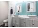 This updated bathroom features a double vanity and matching framed mirrors at 9531 Charter Dr, Indianapolis, IN 46250