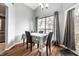 Dining room features a window, curtain, table, and chairs at 9531 Charter Dr, Indianapolis, IN 46250