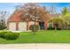 Charming single-story brick home with a well-manicured lawn and a two-car garage at 9531 Charter Dr, Indianapolis, IN 46250