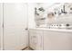 Clean laundry room features a side-by-side washer and dryer with lots of room for storage at 9531 Charter Dr, Indianapolis, IN 46250