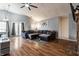 Spacious living room with vaulted ceilings, a cozy fireplace, and hardwood floors at 9531 Charter Dr, Indianapolis, IN 46250