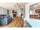Spacious living area connects fireplace, kitchen, with beautiful hardwood floors at 9531 Charter Dr, Indianapolis, IN 46250