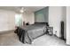 A bright main bedroom boasts a large mandala wall hanging at 9531 Charter Dr, Indianapolis, IN 46250