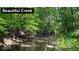 Scenic view of a beautiful creek surrounded by lush greenery at 00 Oak Rd, Westfield, IN 46074