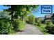 Paved trails amidst manicured lawns and lush trees under a clear blue sky at 00 Oak Rd, Westfield, IN 46074