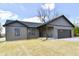 Charming single-story home with neutral siding, attached garage, and well-maintained yard on a partly cloudy day at 1018 N 18Th St, Elwood, IN 46036