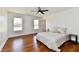 Bright bedroom with wood floors, neutral walls, and large windows allowing for ample natural light at 1018 N 18Th St, Elwood, IN 46036