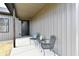 Inviting covered porch with seating area, creating a welcoming entrance to this beautifully built home at 1018 N 18Th St, Elwood, IN 46036