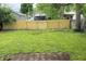 Large, fenced backyard with a well-maintained lawn and freshly installed wood fence at 1032 Groff Ave, Indianapolis, IN 46222