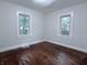 This bedroom has hardwood floors and natural light at 1032 Groff Ave, Indianapolis, IN 46222