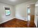Cozy bedroom featuring hardwood floors, natural light, and neutral paint at 1032 Groff Ave, Indianapolis, IN 46222