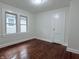 This bedroom has hardwood floors and two windows at 1032 Groff Ave, Indianapolis, IN 46222