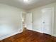 This bedroom features hardwood floors and a neutral color scheme at 1032 Groff Ave, Indianapolis, IN 46222