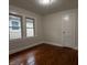 This bedroom features hardwood floors and windows with natural light at 1032 Groff Ave, Indianapolis, IN 46222