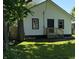Home with a grassy front yard, stairs and black trim around the windows at 1032 Groff Ave, Indianapolis, IN 46222