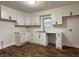 Bright kitchen featuring modern white cabinets, sleek black hardware, subway tile backsplash, and new countertops at 1032 Groff Ave, Indianapolis, IN 46222